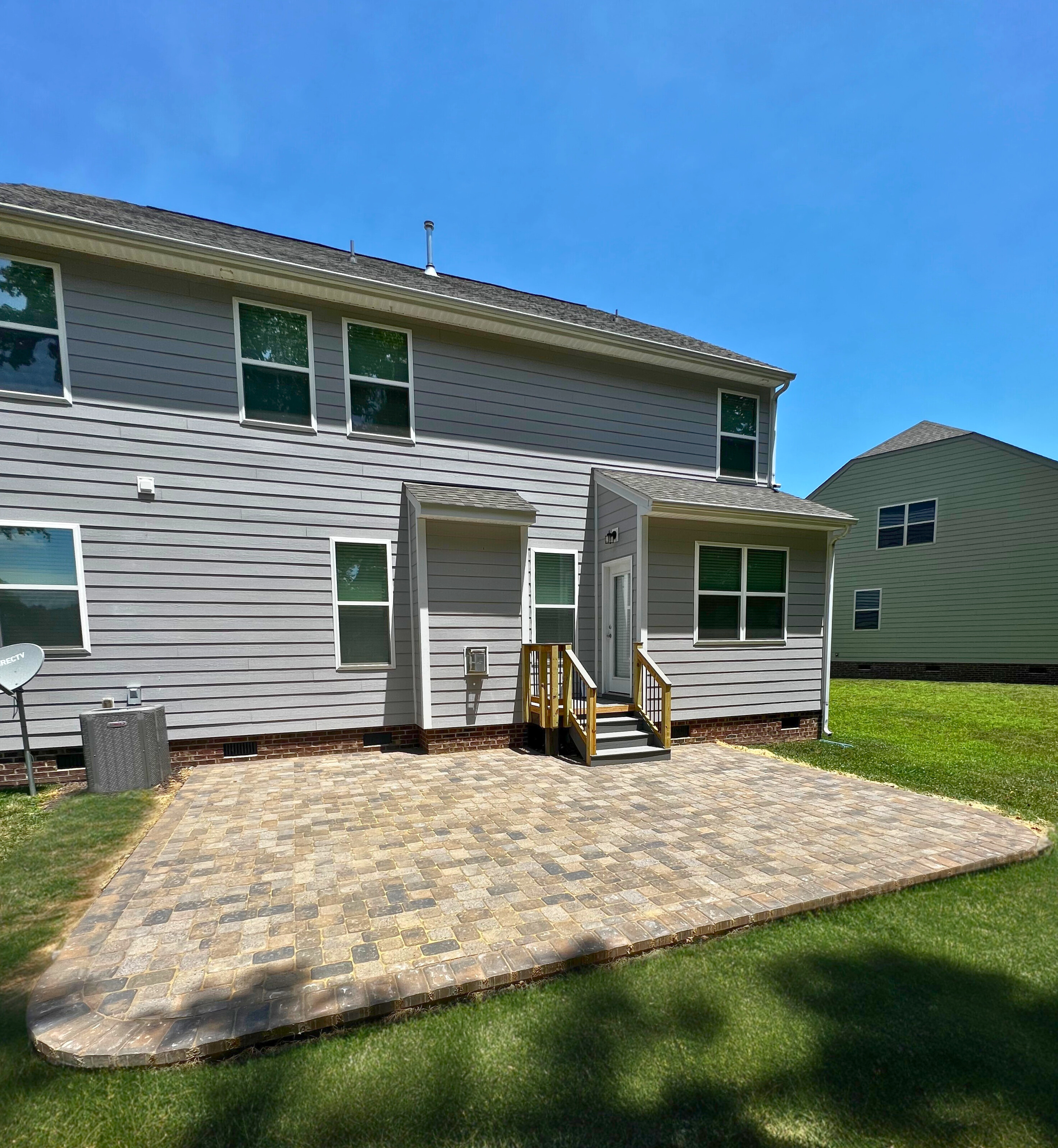 Custom paver patio installation in an Indian Land backyard, providing a durable and stylish outdoor living space.