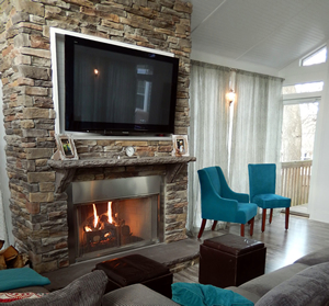 gas burning fireplace with TV above