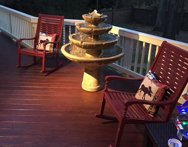 Charlotte wood deck with chairs & water feature
