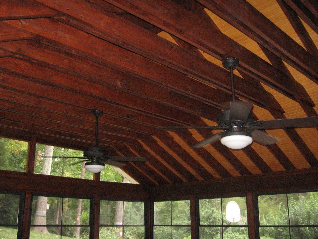 screened in porch with high, exposed ceiling