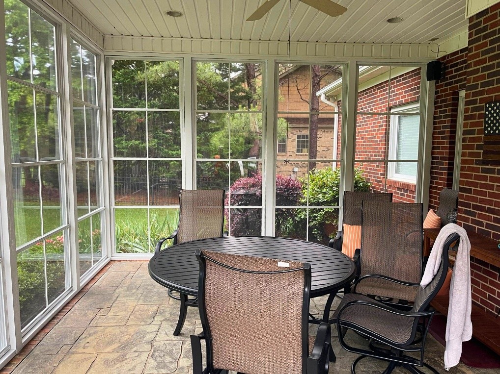 Three Season Room with floor to ceiling Eze-Breeze Windows.