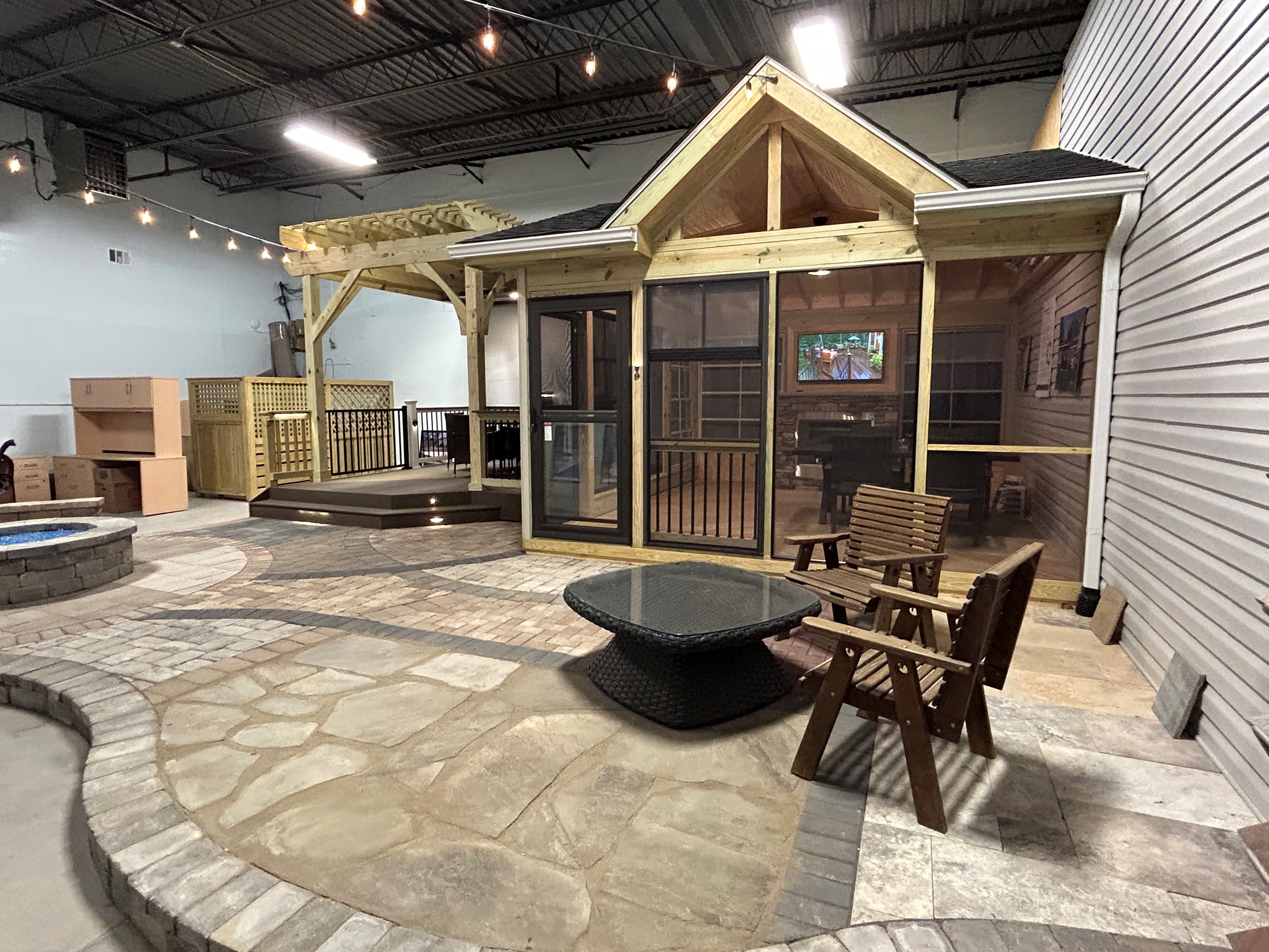 Archadeck of Charlotte design center showroom featuring a custom screen porch and patio display