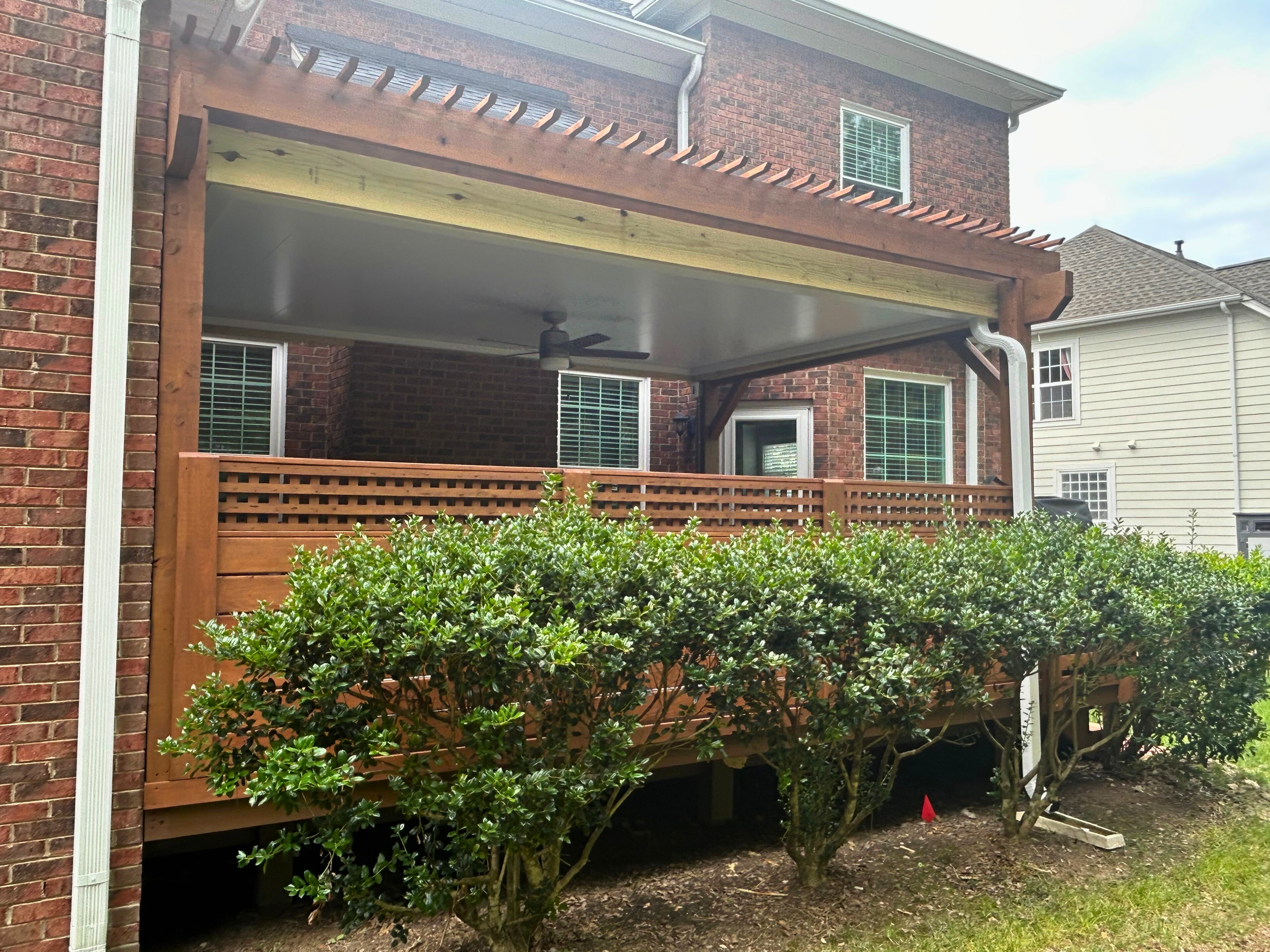 Custom covered pergola and deck addition with privacy lattice in Tega Cay