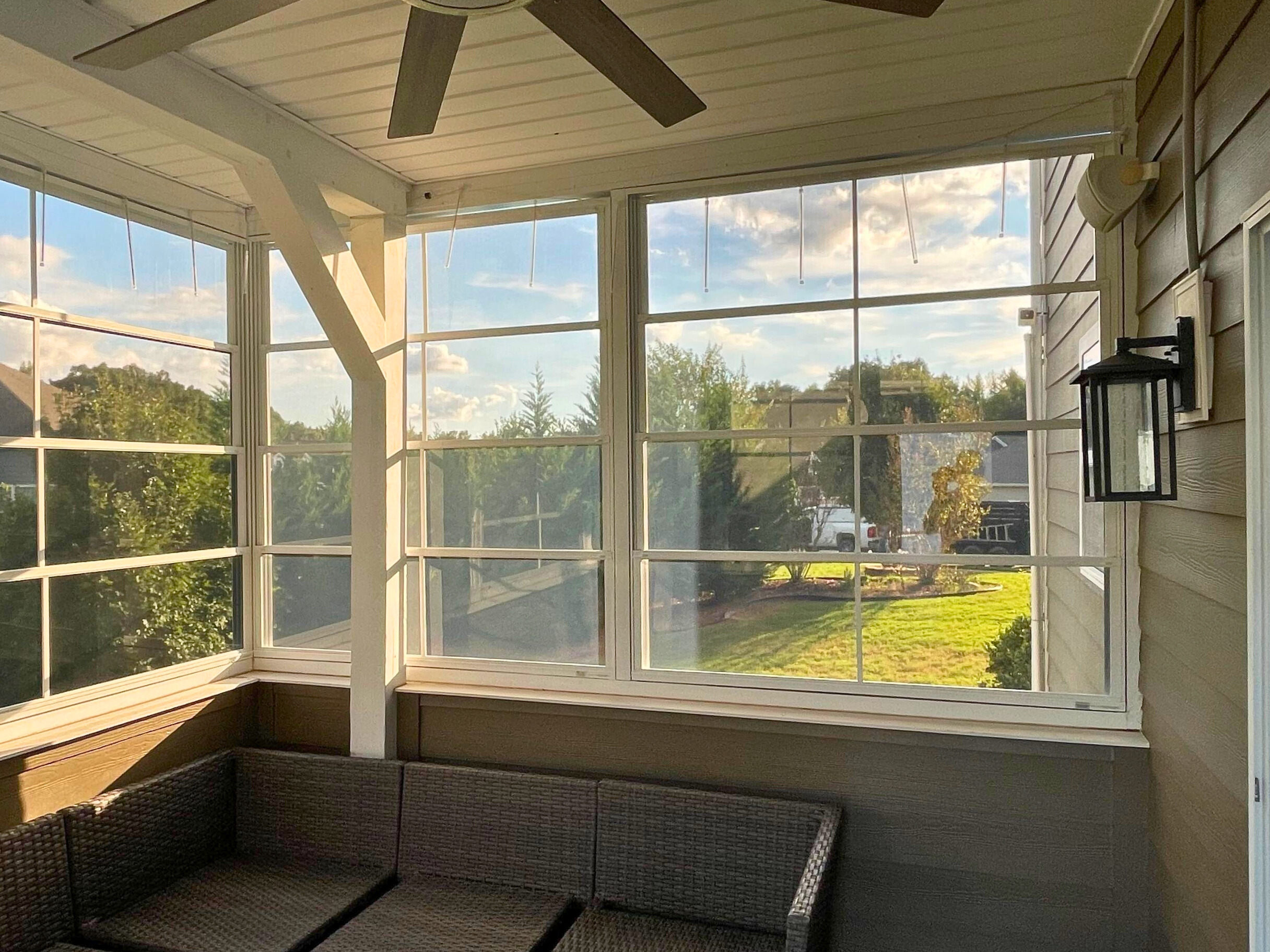 Bright sunroom with large windows and comfortable seating, built by a porch builder in Tega Cay