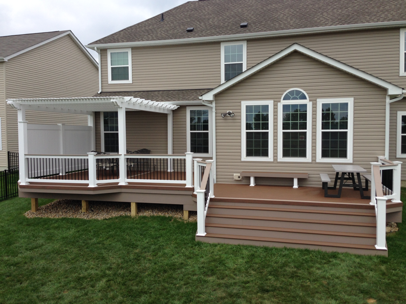 tan deck with white pergola