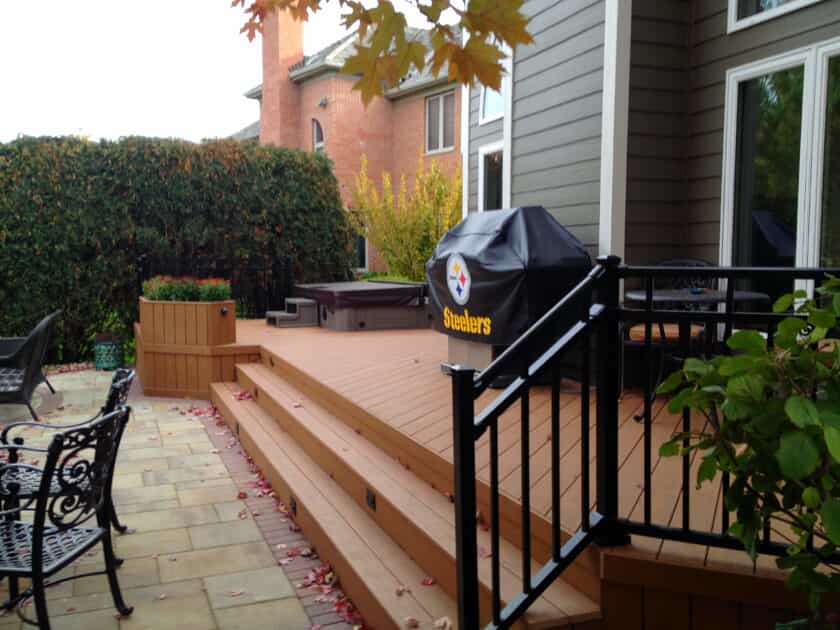 TimberTech deck with rails, barbecue and outdoor furniture