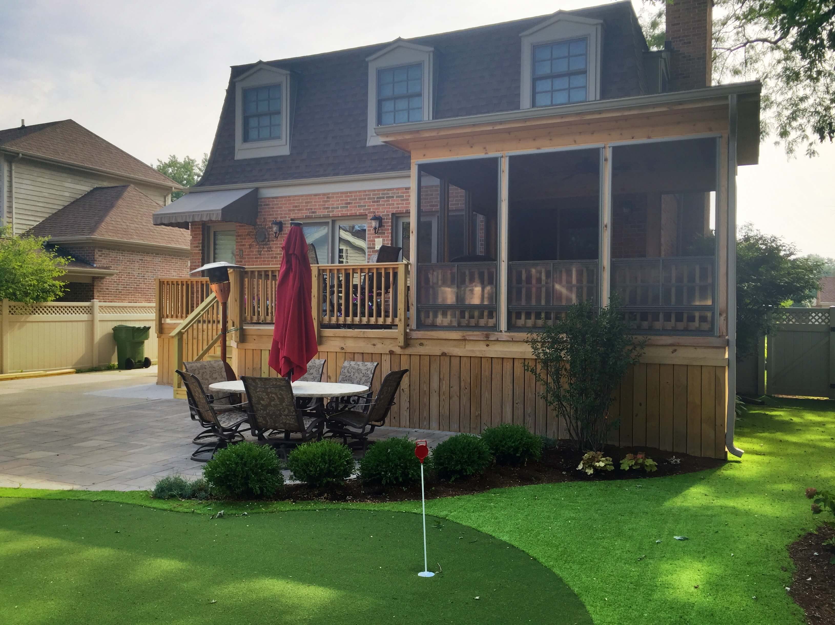 Back yard porch with mini golfing area