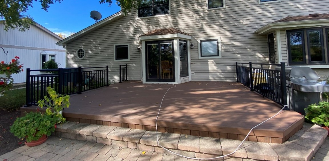 Expansive TimberTech Deck with paver steps and aluminum rails