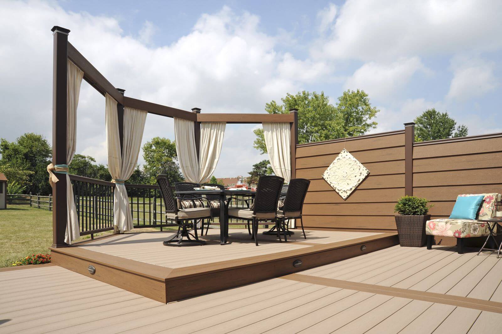 TimberTech Earthwood deck material in Sandy Birch with outdoor furniture