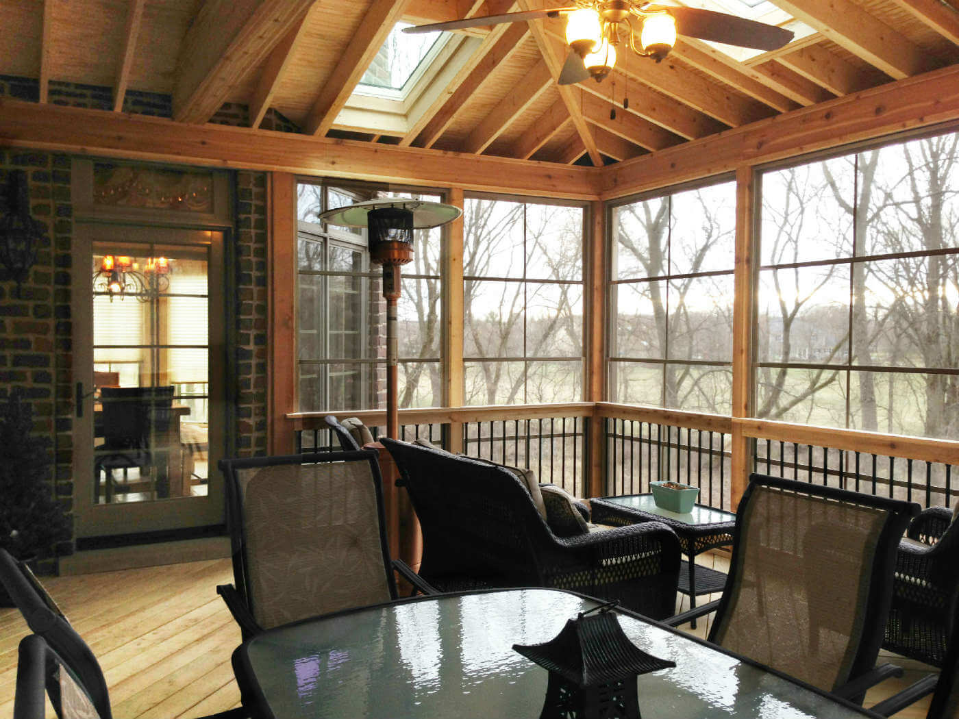 Custom elevated cedar screen porch with sky lights