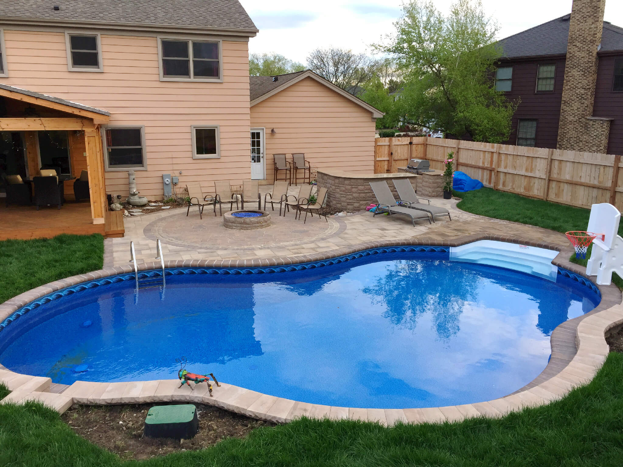 Custom patio pool deck with fire pit