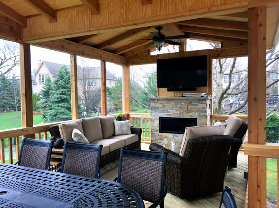 Custom screened porch with outdoor fire place
