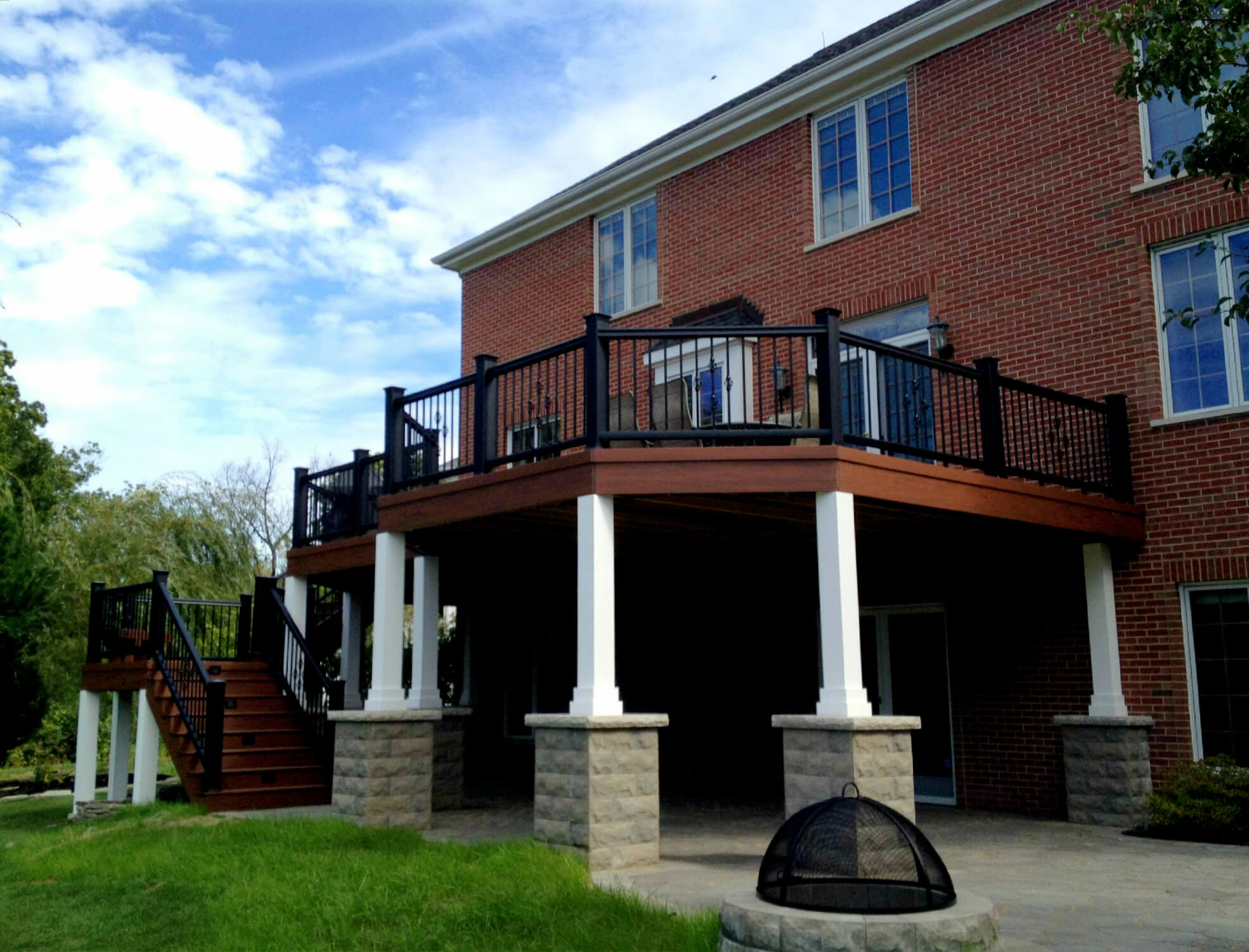 Custom second story deck with patio and fire pit