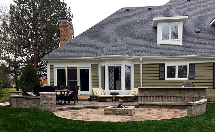 Custom multi level patio with outdoor kitchen and fire pit
