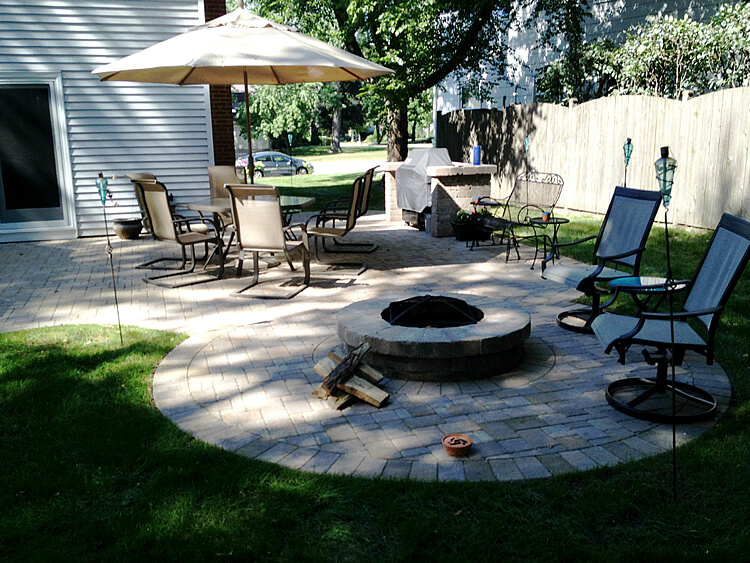 Custom expanded paver patio with fire pit