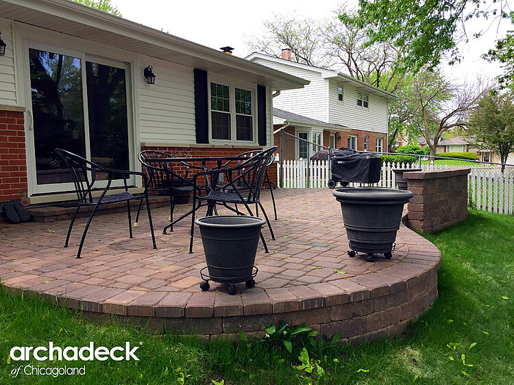 Custom patio with a table and chair in the middle