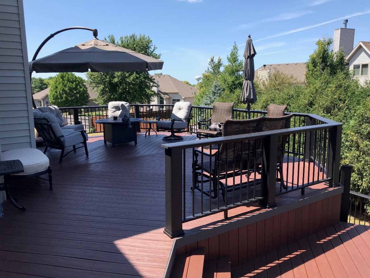 outdoor living space on a deck in a backyard