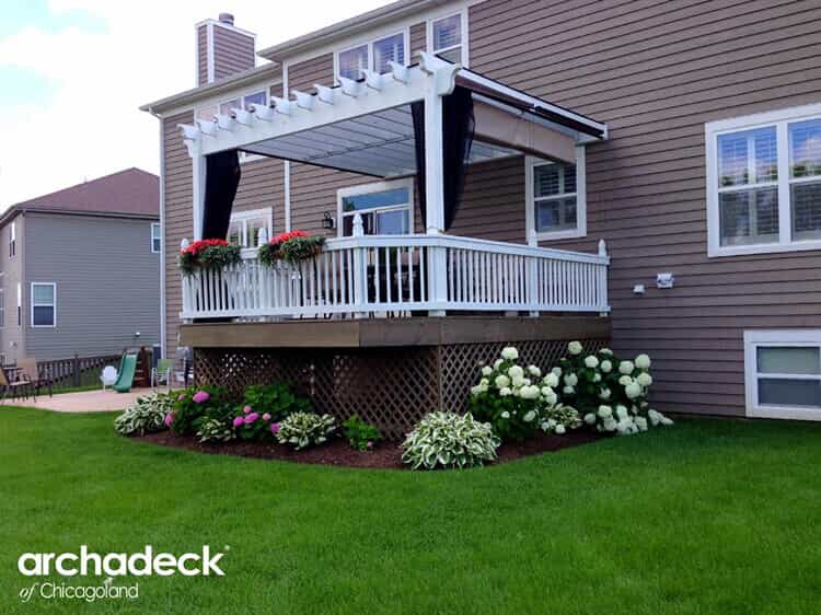 Deck with railing and lattice work, bottom left says "archadeck of Chicagoland"