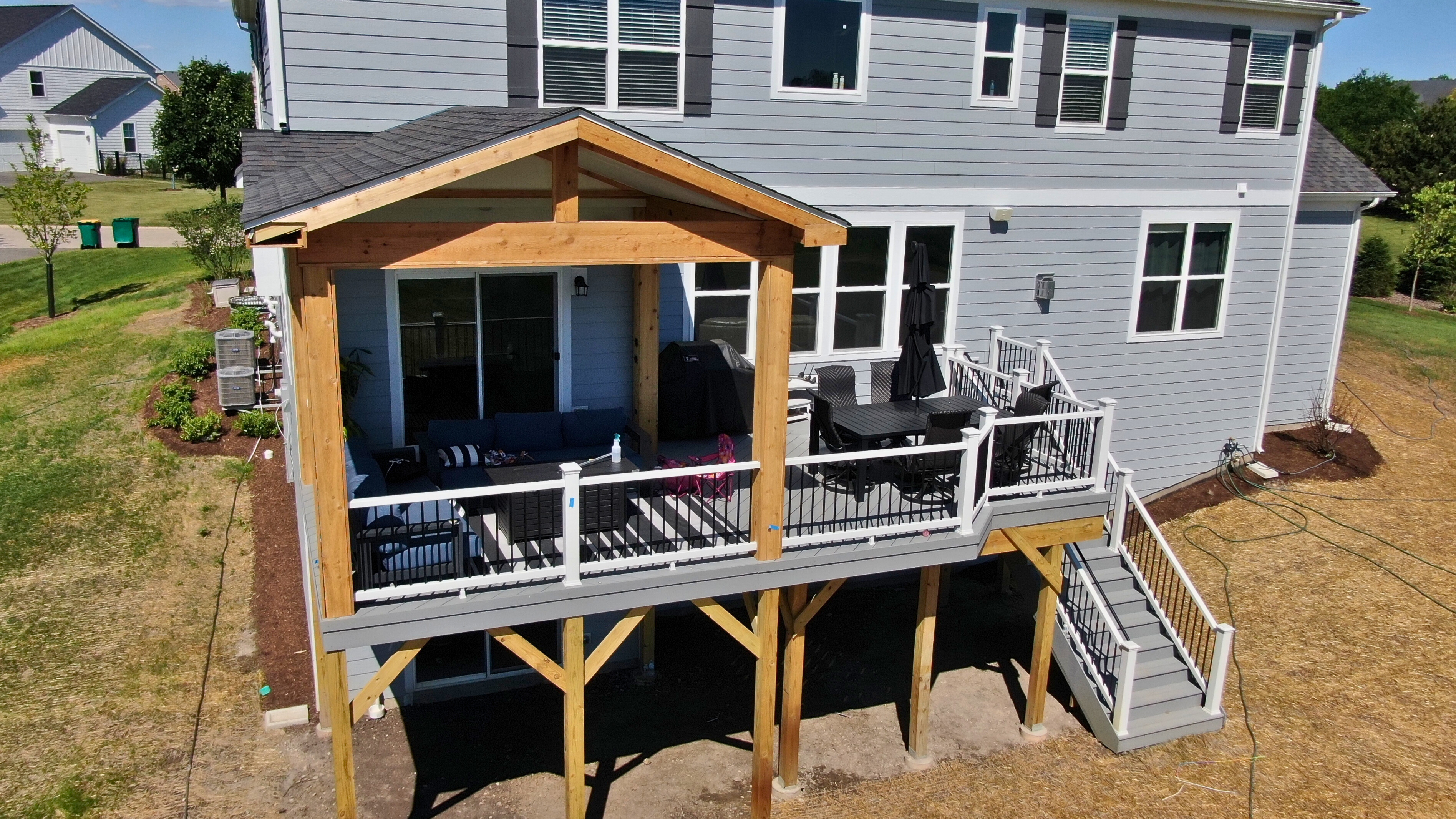 Custom screened porch with Eze-Breeze windows, providing an enclosed outdoor living space for a home in Barrington, IL.