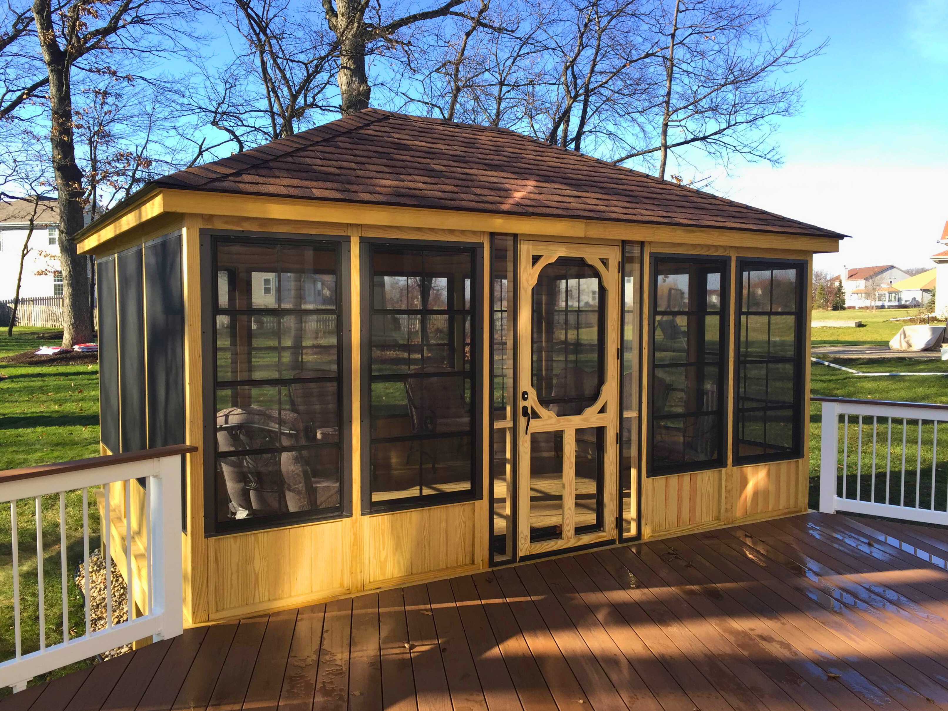 Spacious natural wood deck with integrated railing and ample seating area, built in Hoffman Estates.