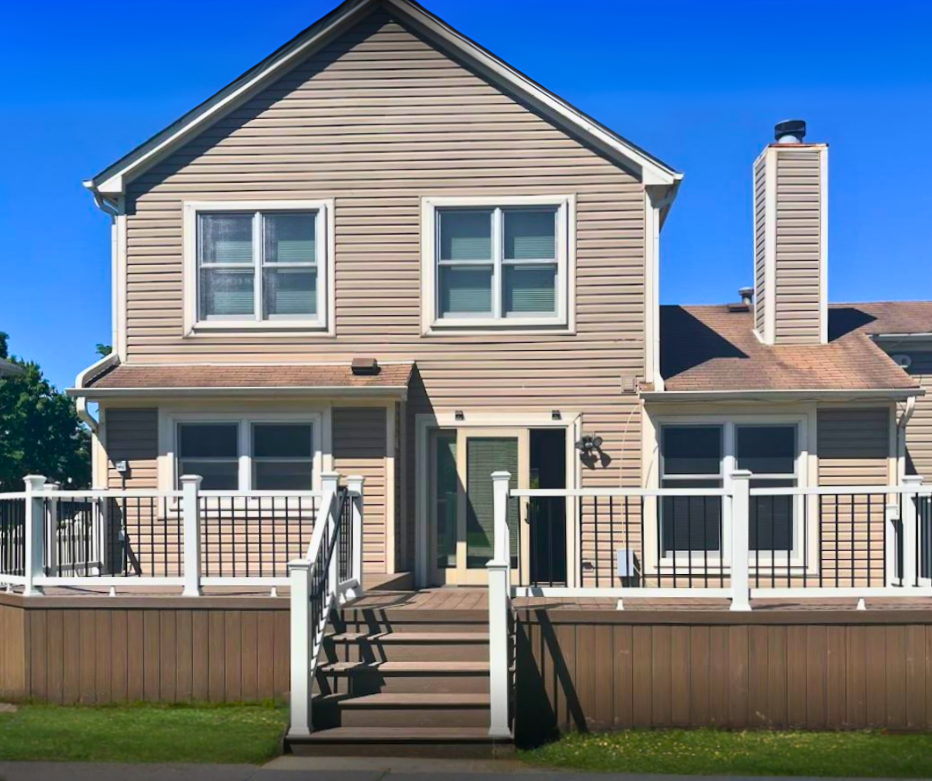 Custom composite deck and four-season sunroom addition in Hoffman Estates, IL by Archadeck of Chicagoland.
