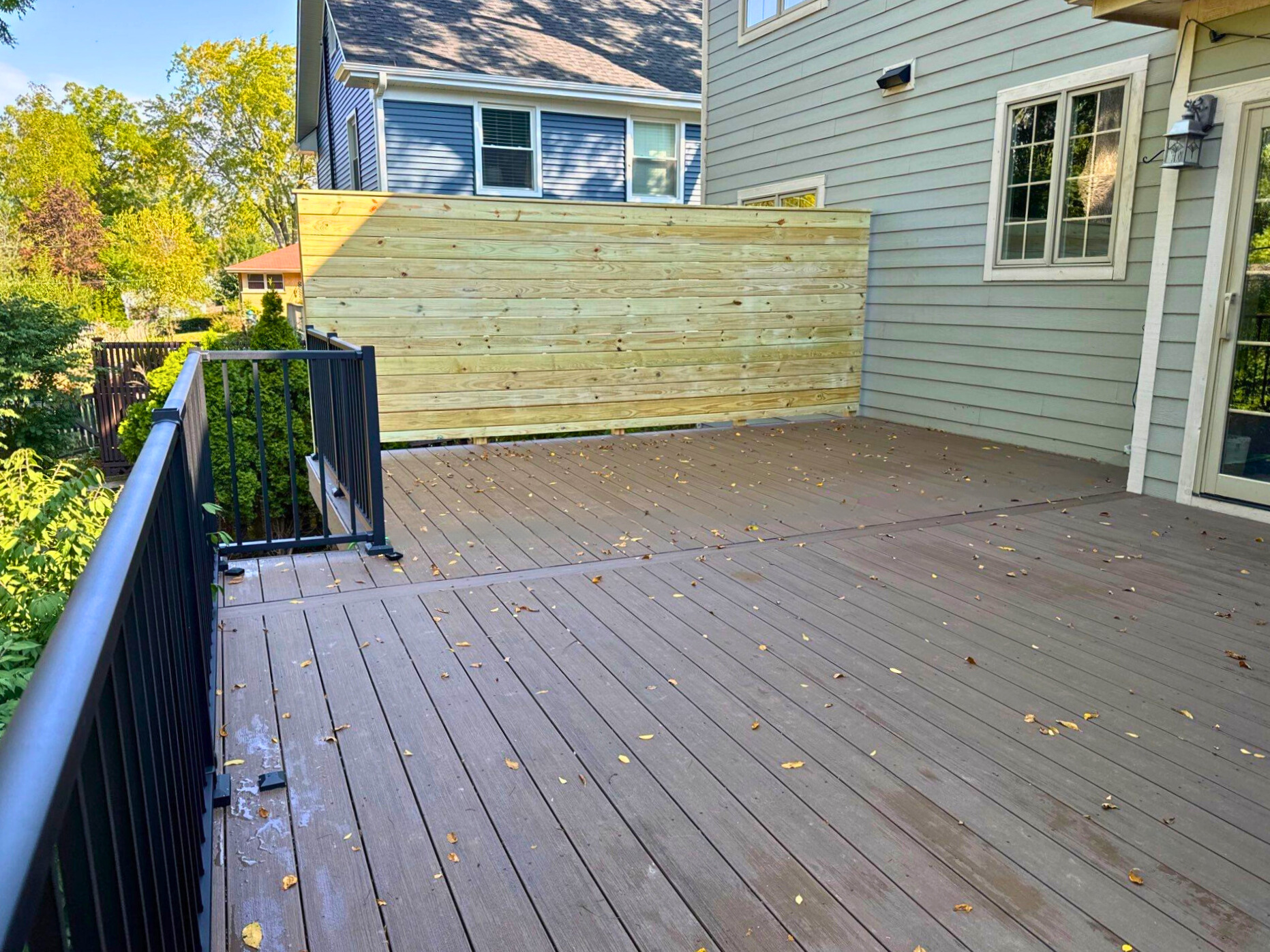 Beautiful custom deck designed and built by Archadeck in Palatine, IL, providing the perfect outdoor living space for relaxation and privacy.