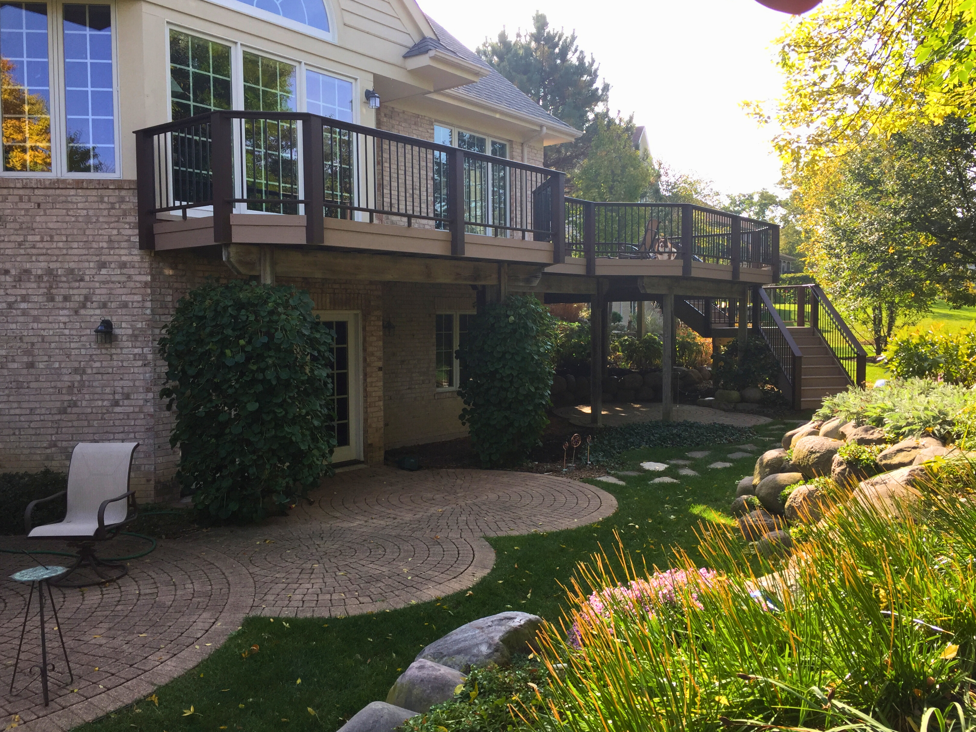 This custom outdoor living space features a stunning second story TimberTech deck with plenty of space to enjoy the beautiful Palatine view with family and friends. 