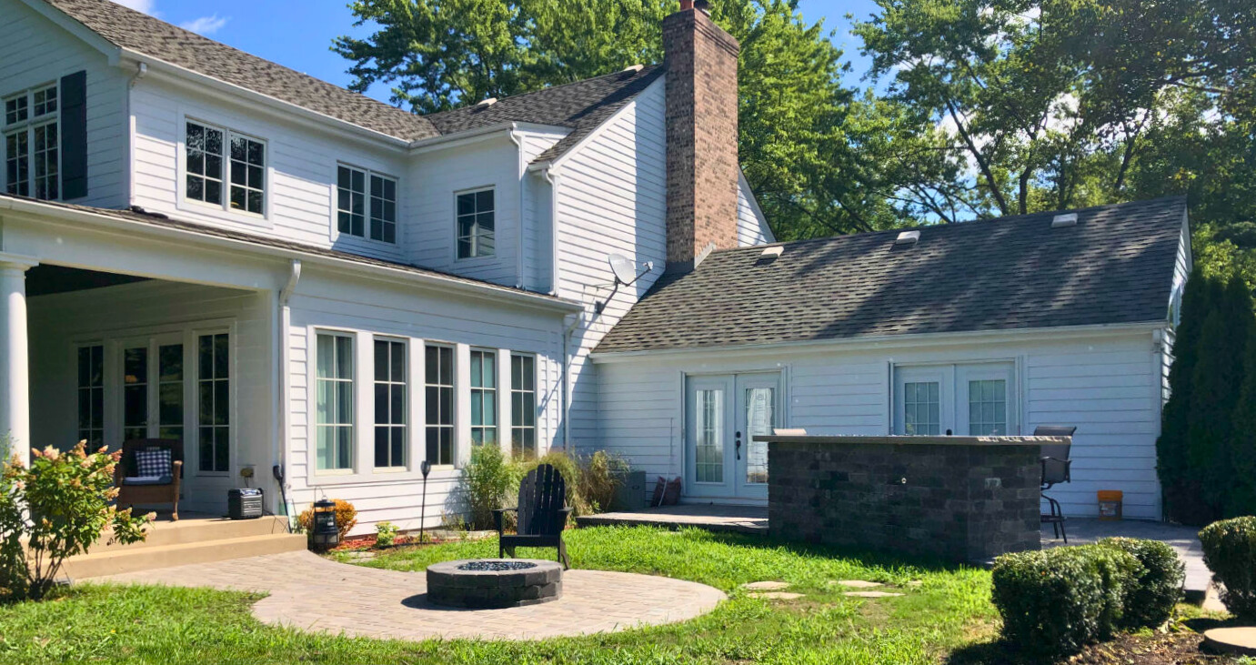 Custom screened porch with Eze-Breeze windows, providing an enclosed outdoor living space for a home in Barrington, IL.