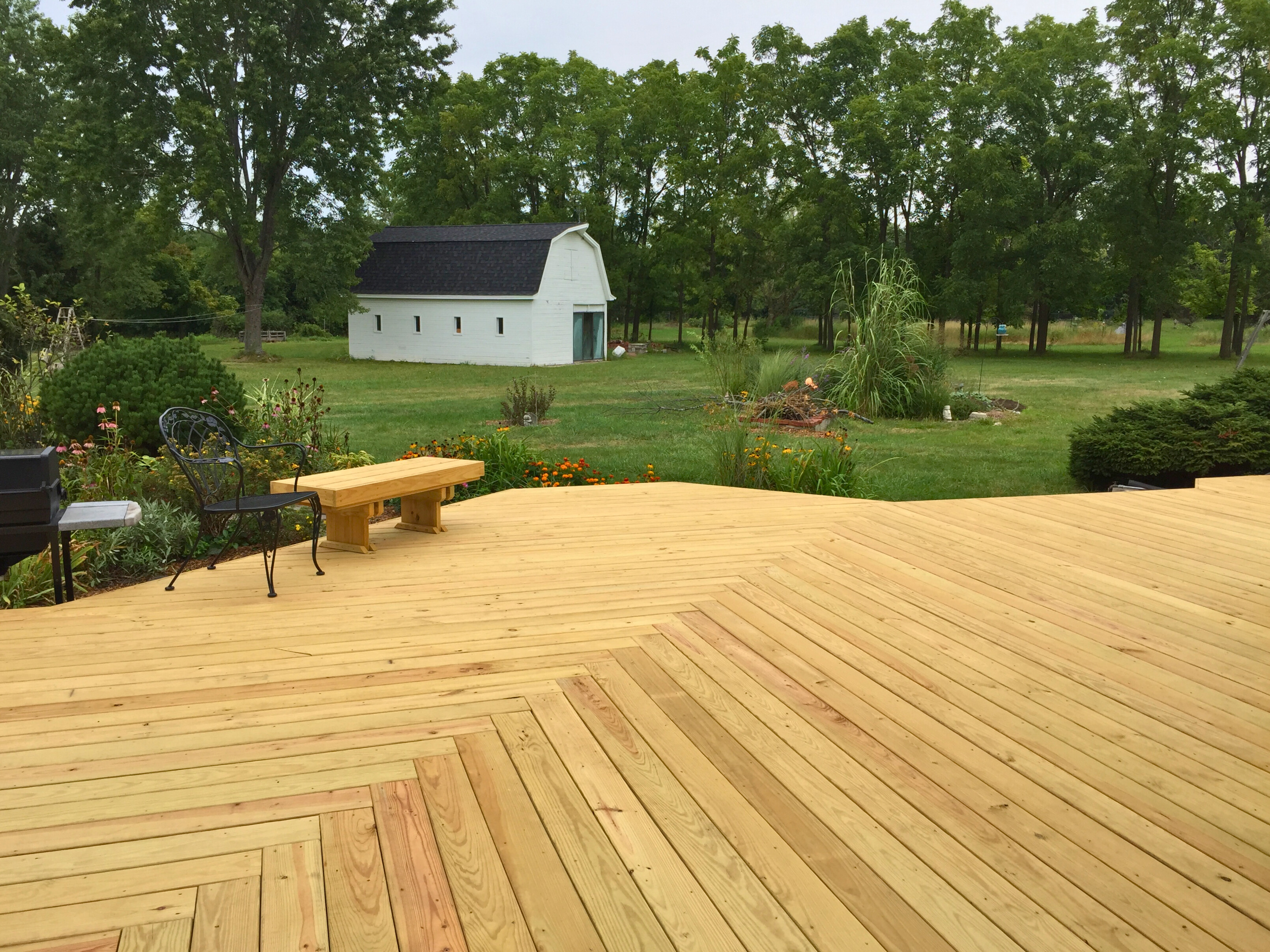 Spacious new pine wood deck with natural wood grain, built by a wood deck builder in Barrington, IL
