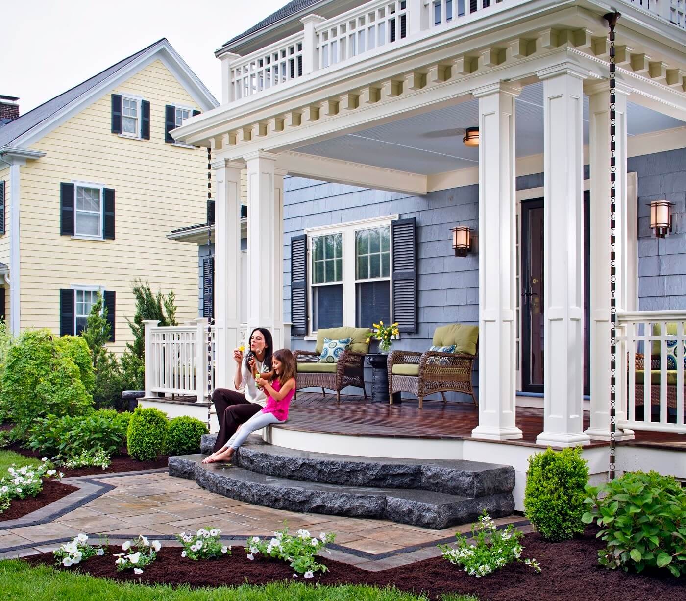 mom and kid sitting on porch