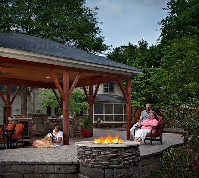 Family enjoying time by a fire pit 