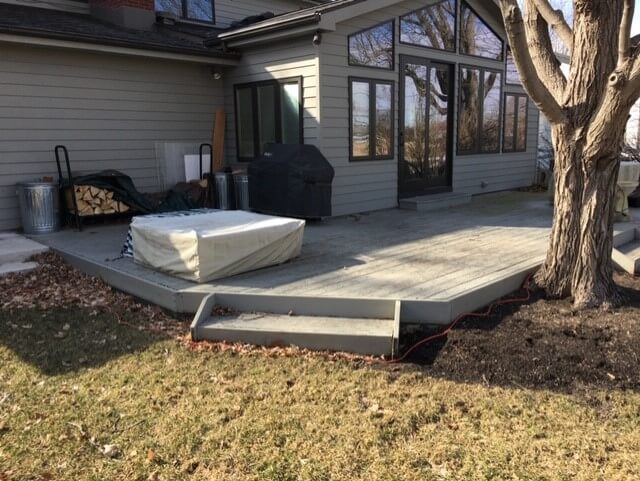 Custom backyard deck with outdoor kitchen