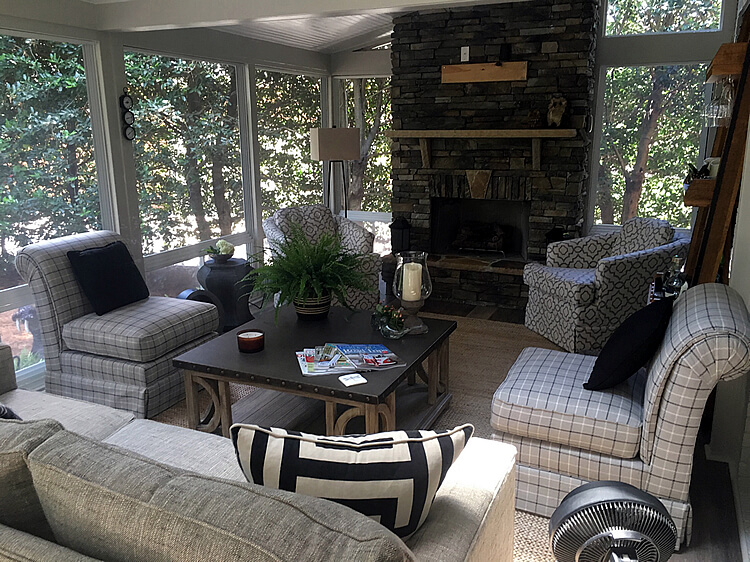Cozy custom screened porch with outdoor fireplace