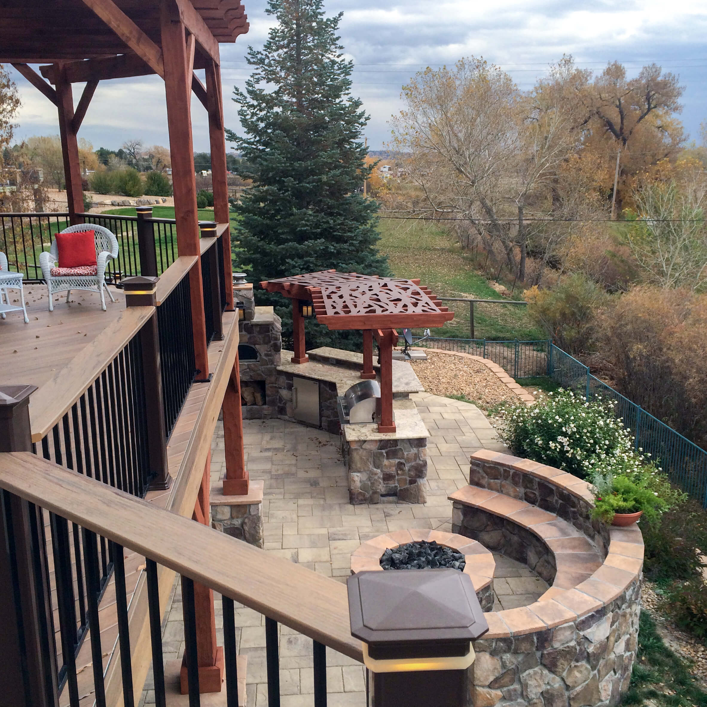 Custom deck and patio with outdoor kitchen and fire pit