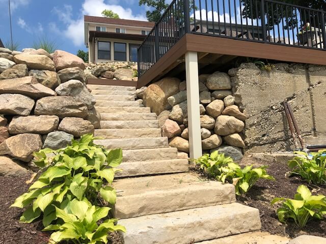 Custom lakeside deck with railing and stairs