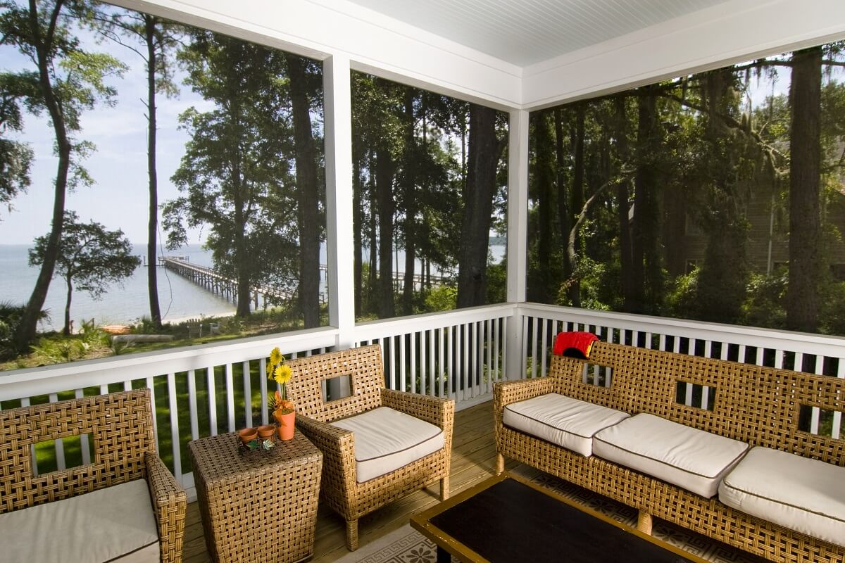 Custom screened porch with dock view