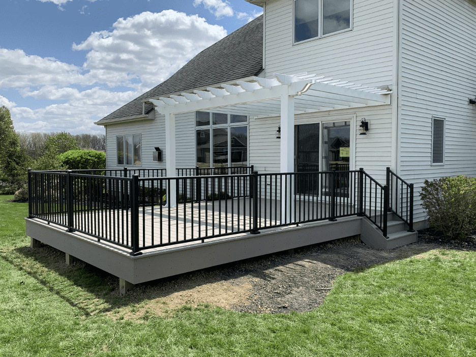 Low maintenance deck with railing and pergola