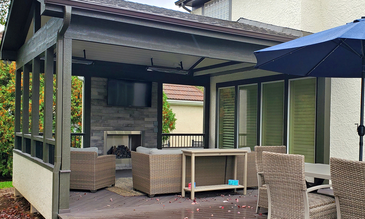 covered porch with radiant heating and outdoor fireplace