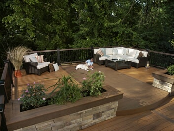 custom deck with planters and railing