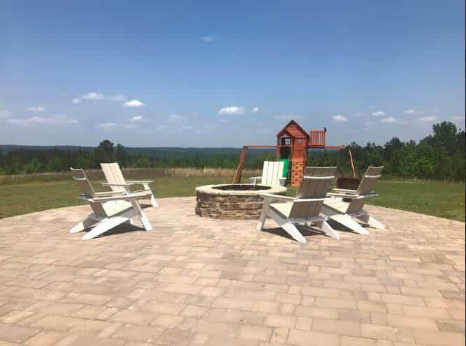 Patio with firepit and swingset