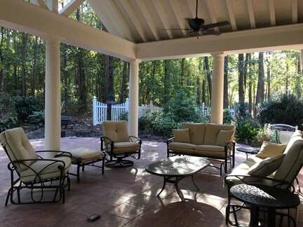 large porch with ceiling fan