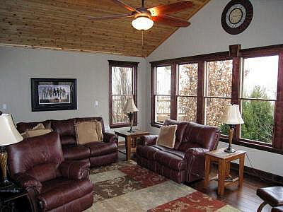 sunroom with leather couch