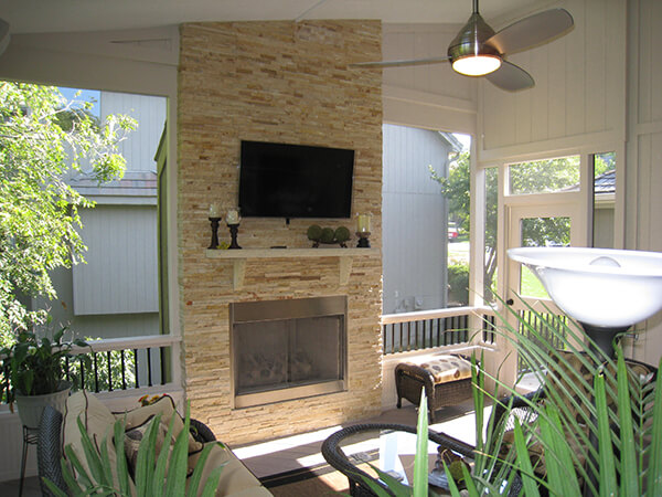 Olathe screened porch with outdoor fireplace