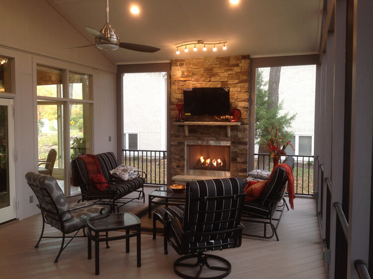 Outdoor fireplace in screened in porch 