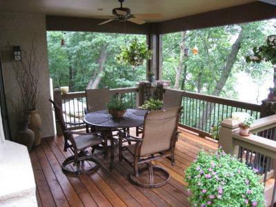 Seating area on open porch with plant decors
