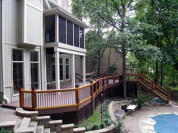 Custom backyard deck with railing and staircase