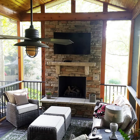 Custom outdoor fireplace on screened porch