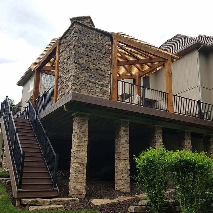 Custom wood deck with pergola and stone columns