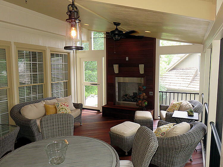 Cozy screened porch with outdoor fireplace