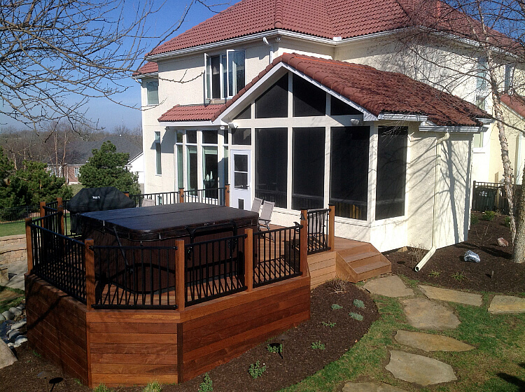 Custom screened porch with hot tub deck